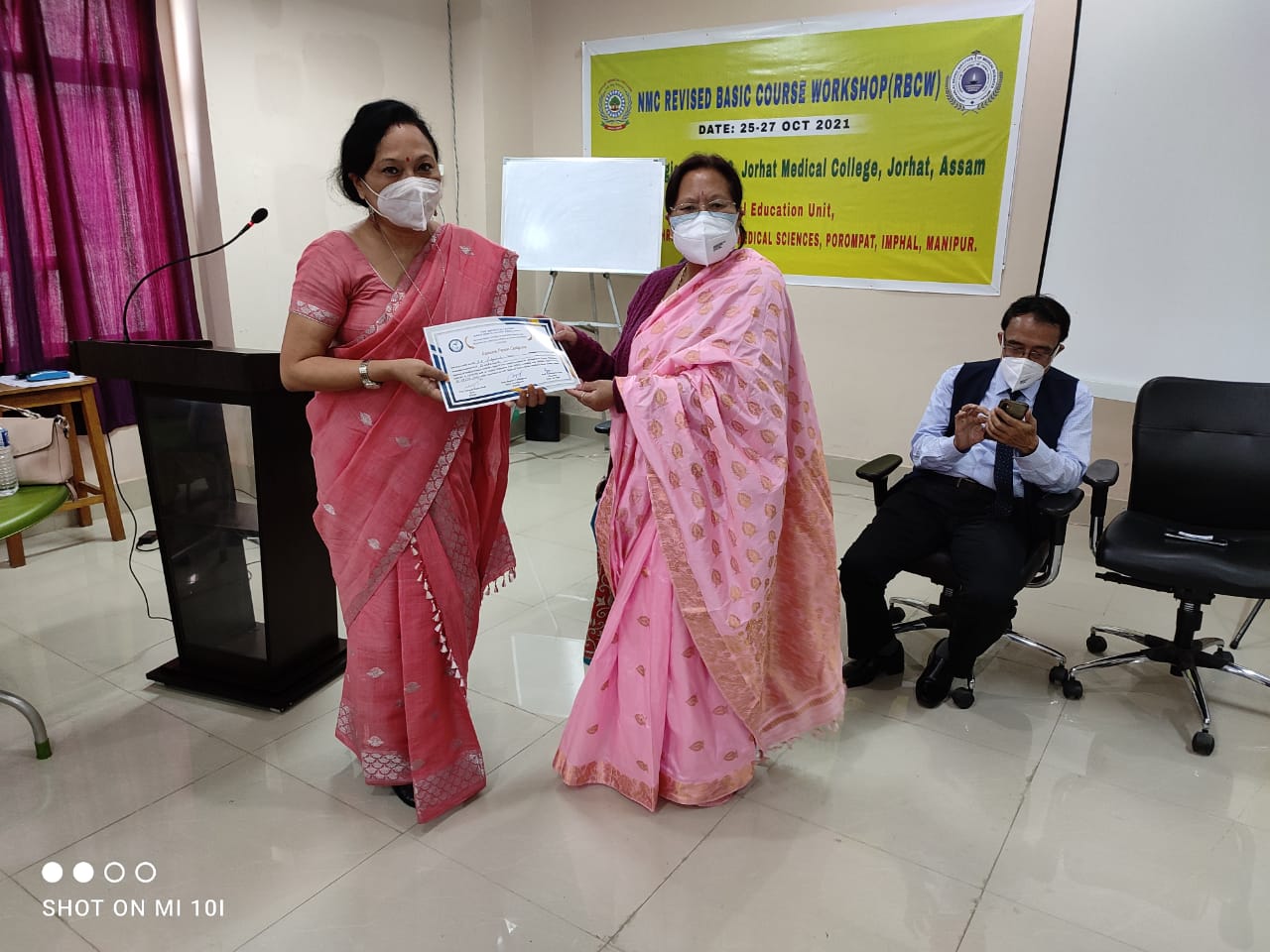 Receiving Certificate from the NMC observer for Resource Person Revised Basic Course On 281021